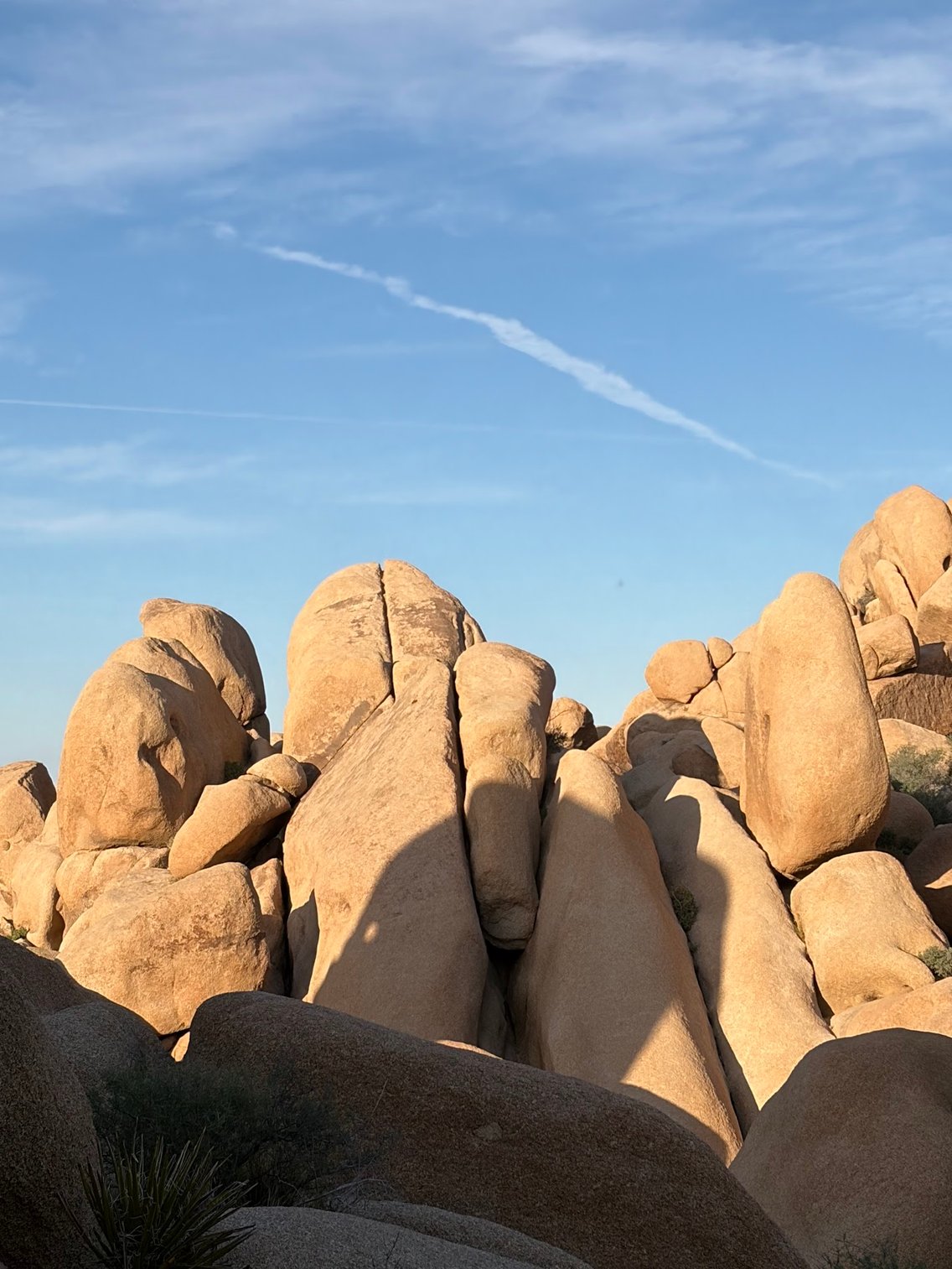 Golden rock formations against a blue sky