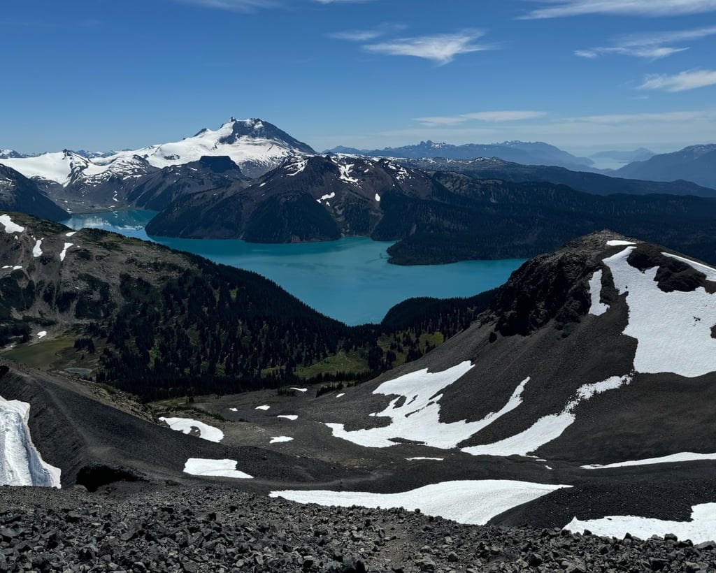 Mountain lake below snow-covered peaks